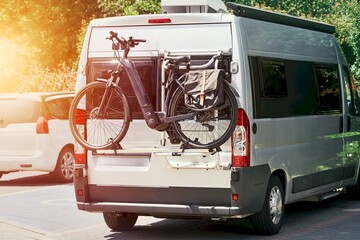 Silver camper van with bike on rear rack