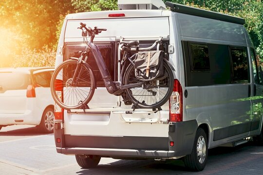 Silver camper van with bike on rear rack