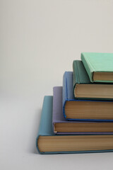 Open book, hardback colorful books on table. Back to school. Copy space for text. Education business concept
