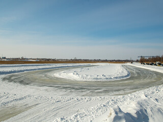 Obraz premium Winter go-karting. Preparation of the ice track for the competition