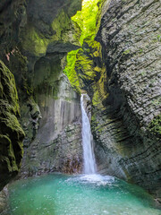 Soca Valley, Slovenia &ndash; Aerial view of the emerald-green Alpine River Soca on a bright sunny summer day with green foliage..The last wild river in Europe in Triglav National Park near the Vricic Pass