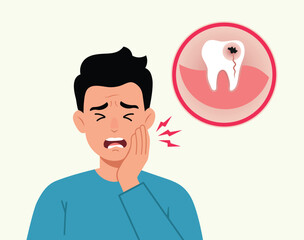 Man has toothache and is holding his cheek in pain