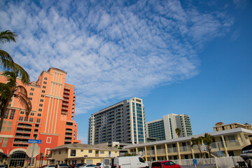 hotels and lush green palm trees in the city skyline at sunrise in Clearwater Florida USA
