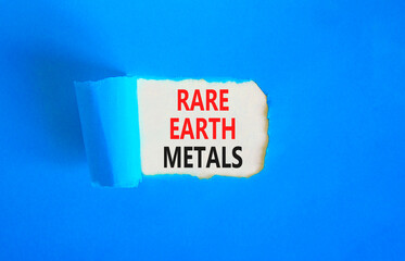 Rare earth metals symbol. Concept words Rare earth metals on beautiful white paper. Beautiful blue paper background. Business and rare earth metals concept. Copy space.