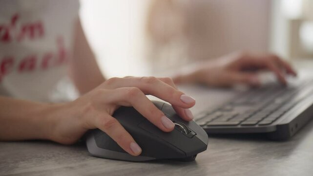 Close-up of hand using a computer mouse