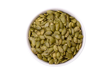 Peeled pumpkin seeds in a bowl, an ingredient for making vegetarian food