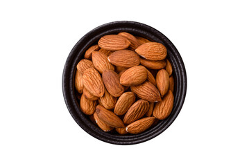 Roasted or raw peeled almonds in bowl