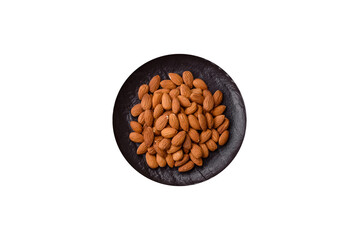 Roasted or raw peeled almonds in bowl