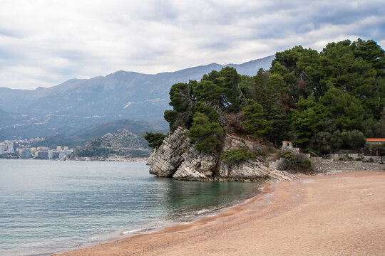 Milocer park facing Adriatic sea, Sveti Stefan beach and mountains in the background. Winter in Montenegro.