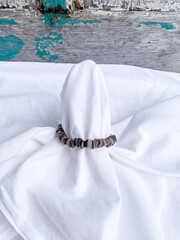 Bracelet with square cut hammer shell beads