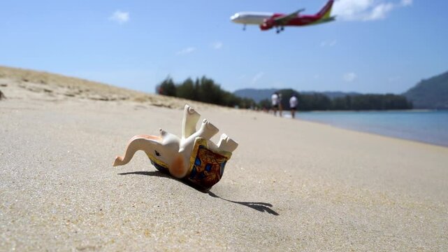 An elephant figure on the beach. Tourism and travel concept