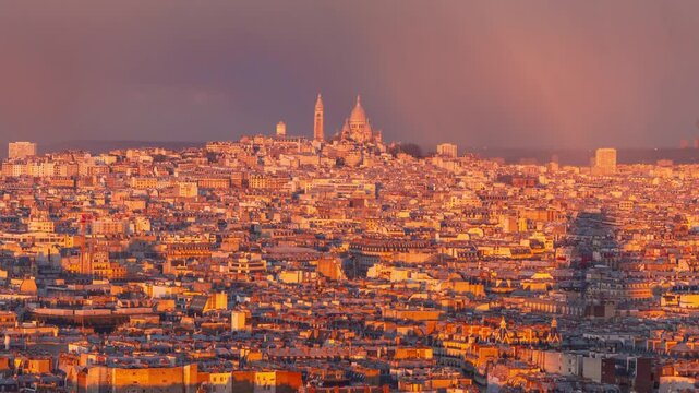 4K timelapse of Paris panorama during sunset golden hours, with clouds moving, dramatic light changing and sun rays walking over reaching the Sacre Coeur Basilica in the distance, skyline of Paris