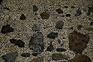 texture of concrete wall with rough granite boulders