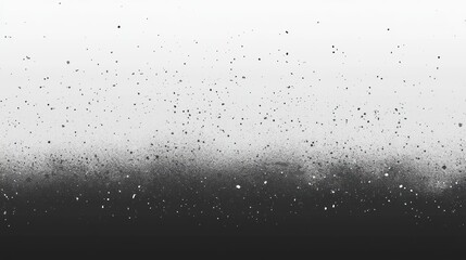 Obraz premium Abstract grayscale texture with gradient and scattered particles.