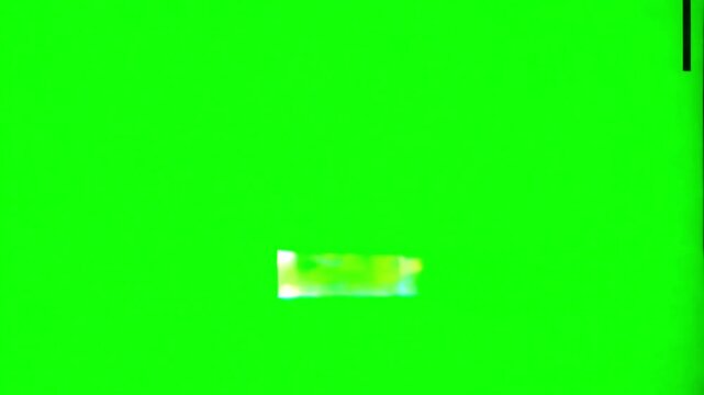 Video glitch damage on green screen background. VHS Static Noise, Tracking Errors, and VHS Flickering on a Green Background.