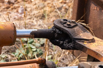 Industrial machinery maintenance close-up overview from ground level at construction site