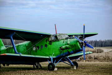 old green plane with propeller