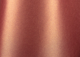 Burgundy paper background with a glossy, pearlescent texture and shimmering metallic finish. Warm,...