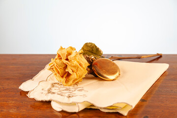 Melancholic composition of still life objects symbolizing past memories and timeless elegance