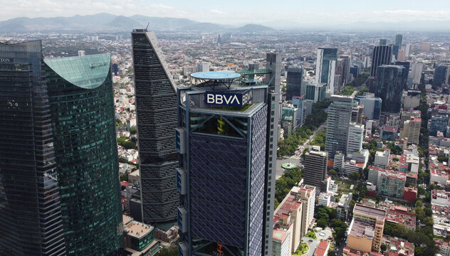 Mexico City, Mexico - August 25, 2021: Aerial view of BBVA bank tower and the iconic Paseo de La Reforma avenue during a sunny morning.