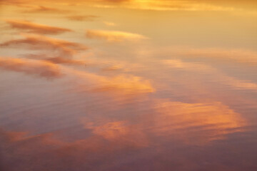 Golden Clouds Reflected in Water