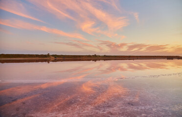 Pink Clouds Reflected in Salt Lake at Sunset