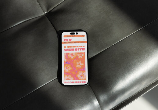 Mobile Phone Resting on a Dark Leather Surface With Soft Lighting for mockup