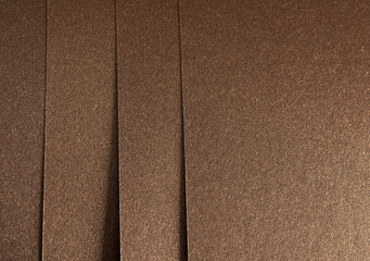 Fototapeta premium Elegant brown paper texture with a subtle grainy surface and shimmering effect. Premium monochrome material, perfect for luxury stationery, artistic backdrops, and decorative designs..