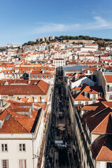 Obraz premium View of Lisbon from the famous Santa Justa viewpoint, showcasing the city's rooftops and historic landmarks