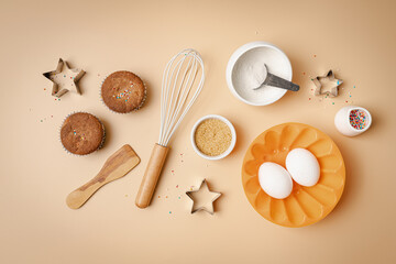 Baking or cooking colorful background. Ingredients, kitchen items for baking. Kitchen utensils, flour, eggs, sugar and muffins. Text space, top view.
