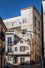 Lisbon, Portugal - January 2, 2025: A charming corner near Lisbon's Fado district, showcasing traditional architecture and tiles, Rua dos Cegos.