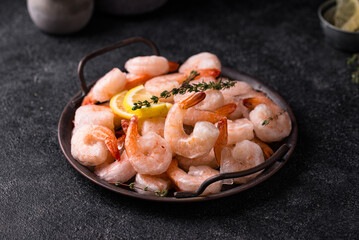 Frozen uncooked prawns or shrimps with lemon