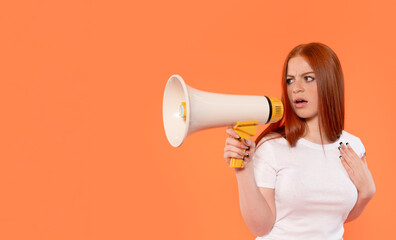 Woman with red hair speaks into a megaphone expressing her thoughts against a vibrant orange background