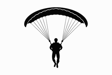 silhouette of a paraglider