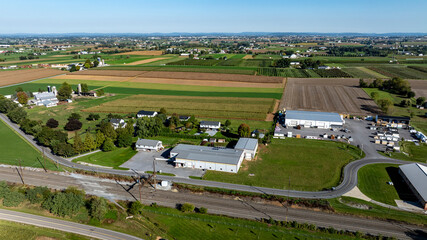 Overhead View of Agricultural Landscape Featuring Farms and Fields in a Rural Setting During Clear Weather