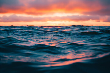 Fototapeta premium Ocean Water Reflecting Sunset Hues and Colorful Sky During Twilight