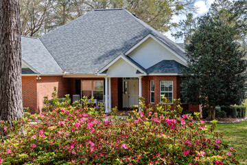 North Florida Residential Colonial Brick House with Blooming Azaleas