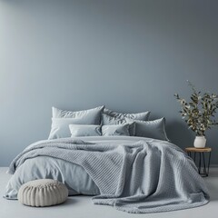 A serene bedroom with a calming blue color palette.  Soft textures and minimalist decor create a relaxing ambiance