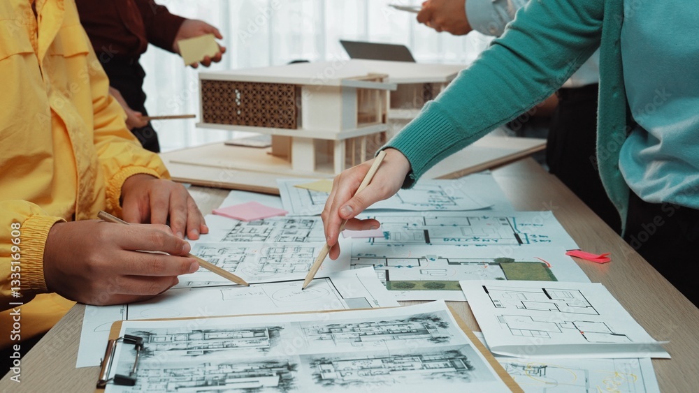 Poster a vibrant architectural design meeting showcases hands actively sketching blueprints and analyzing m