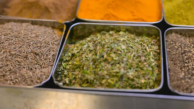 Spices. Various Indian Spices. Spice and herbs in a restaurant. Assortment of Seasonings, condiments. Cooking ingredients, flavor. 4K UHD video