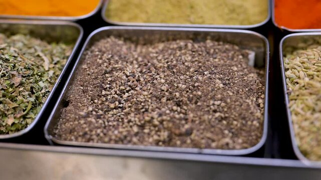 Spices. Various Indian Spices. Spice and herbs in a restaurant. Assortment of Seasonings, condiments. Cooking ingredients, flavor. 4K UHD video