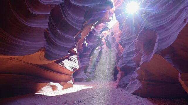 Sunlight streaming into antelope canyon with vibrant red rock walls, serene atmosphere. Nature wonder and exploration concept