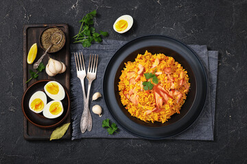 hot smoked salmon kedgeree in a black bowl