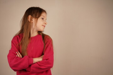 Her composed posture highlights her strong presence. The bright setting frames her striking...