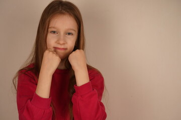 With fists raised confidently, the young girl conveys a sense of defense and resolve. Her intense...