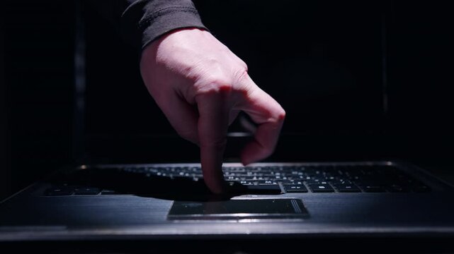 Fingers of person's hand dancing cancan on laptop keyboard close-up. Expressing joy, success, good mood with hands.