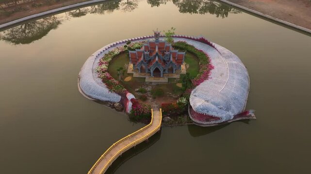 Aerial angle of temple glowing under soft sunrise tones. Aerial drone video