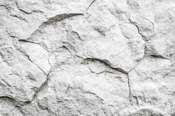 Fototapeta premium White rock texture. Light gray stone wall background with space for design. Cracked surface.