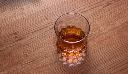 Refreshing whiskey on wooden Table. Whiskey image captures a simple, refreshing beverage scene, suitable for drink, lifestyle, or summer-themed projects.