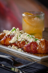 Bacon Wrapped Plantains topped with Feta.